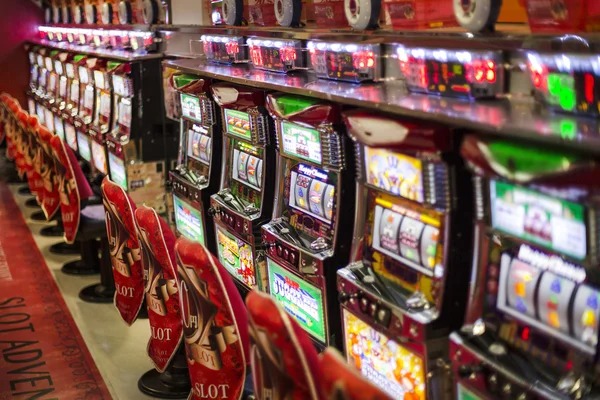 Live dealer studio broadcasting AduQ game with multiple camera angles and real-time card display